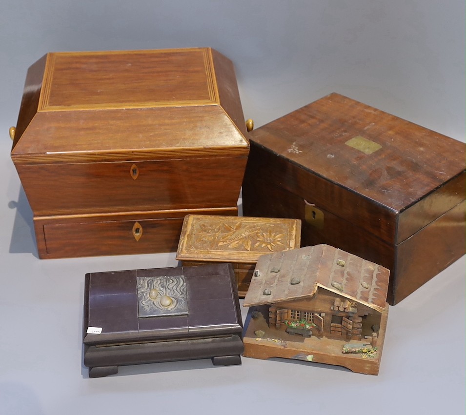 A Victorian mahogany sarcophagus work box, width 30 cms, a Victorian walnut sewing box and three others.